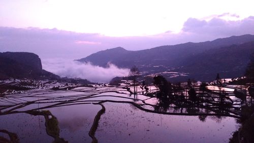 Scenic view of lake against sky during winter