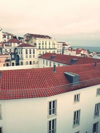 Houses in town against sky