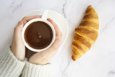 High angle view of coffee cup on table