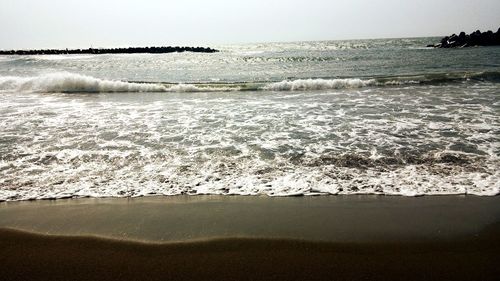 Scenic view of beach against sky