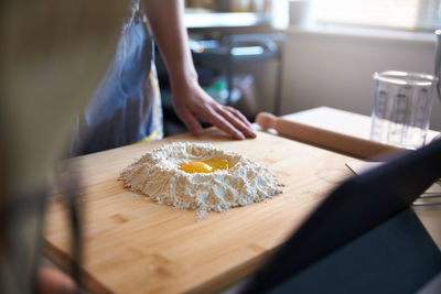 Midsection of person preparing food at home