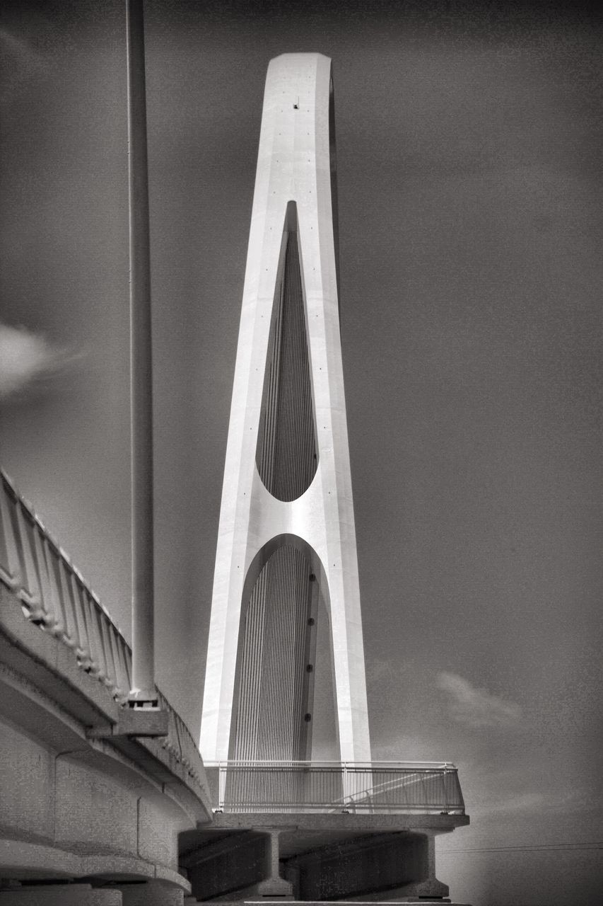 LOW ANGLE VIEW OF BRIDGE AGAINST BUILDING