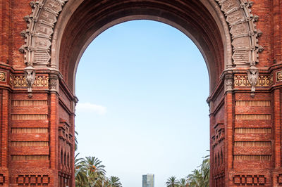 Architectural close-up on the center of the monumental red brick arch of barcelona in spain