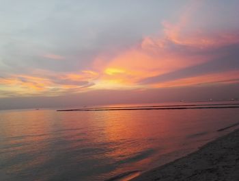 Scenic view of sea against sky at sunset