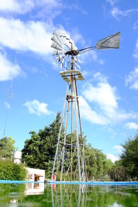 Low angle view of wind turbine against sky