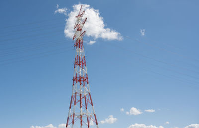 Low angle view of electricity pylon against sky