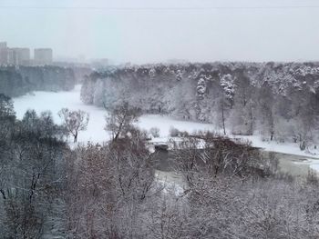 Scenic view of landscape against clear sky during winter