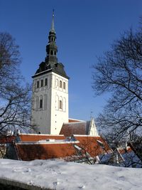 Low angle view of building against sky during winter