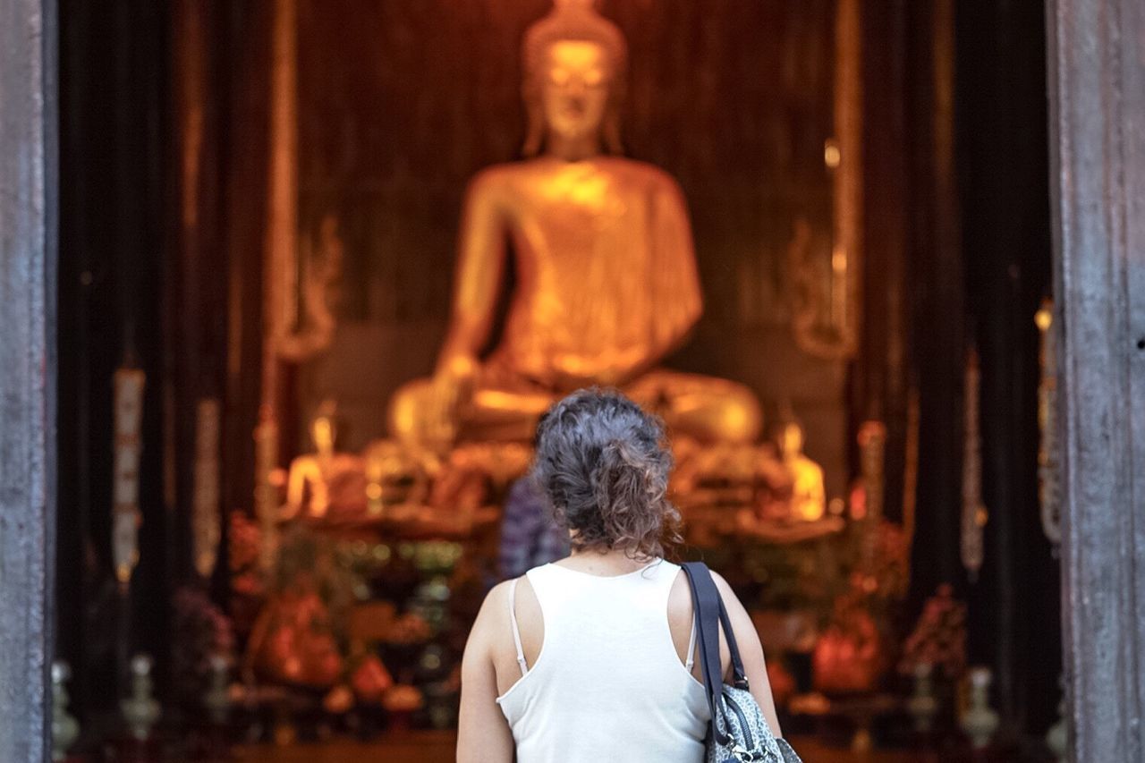 lifestyles, rear view, standing, men, focus on foreground, casual clothing, leisure activity, waist up, three quarter length, person, built structure, architecture, building exterior, headshot, indoors, holding, spirituality, religion