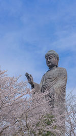 Low angle view of statue against sky