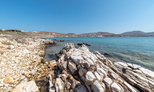 Scenic view of sea against clear blue sky