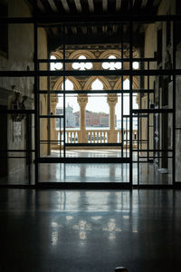 Reflection of building on glass window palazzo ducale venice