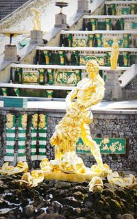 Close-up of statue against building