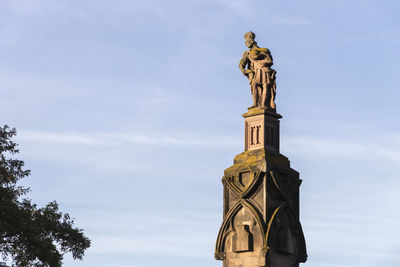 Low angle view of statue against sky