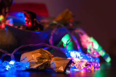 Close-up of illuminated lighting equipment on table