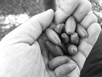 Close-up of father holding hand