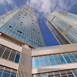 Low angle view of modern buildings against sky