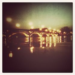 Bridge over river at night