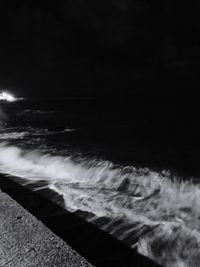 Scenic view of sea against sky at night