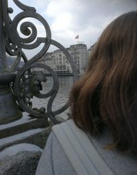 Rear view of woman looking at city