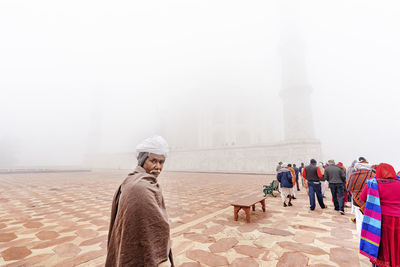 Group of people in foggy weather