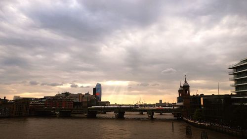 Bridge over river with buildings in background