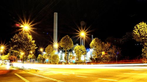 Illuminated light trails on street at night
