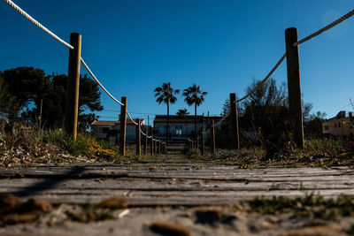 Surface level of railroad tracks against clear sky