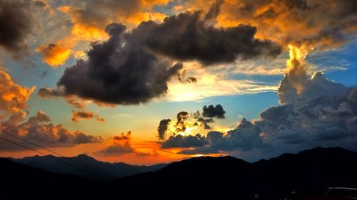 Scenic view of dramatic sky during sunset