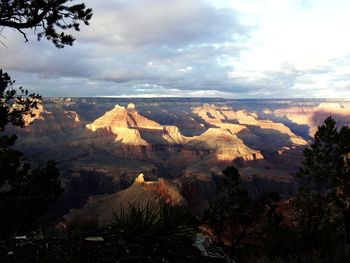 Scenic view of landscape and mountains against sky