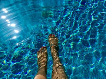 Low section of woman in swimming pool