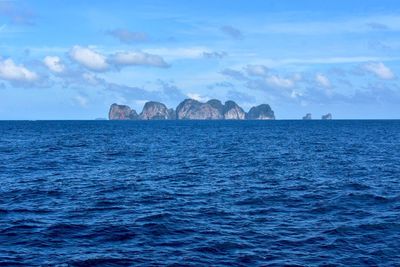 Sea with mountains in background