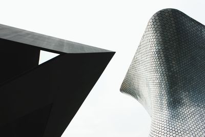 Low angle view of modern buildings against sky