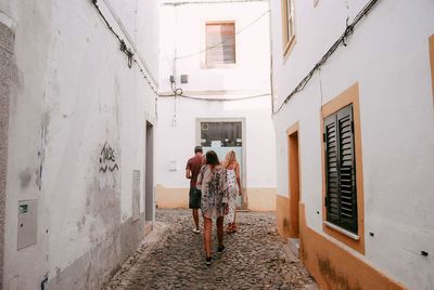 Rear view of people walking in building