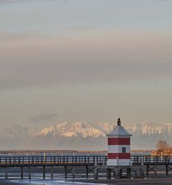 Building by sea against sky