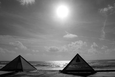 Tents at beach against sky