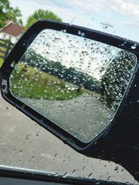 Wet car window during rainy season