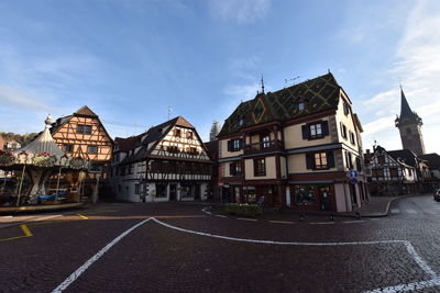 Buildings in city against sky