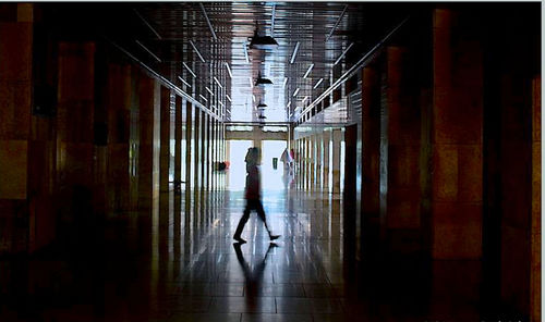 Silhouette of man using mobile phone