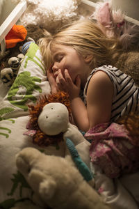 Small girl sleeping in bed