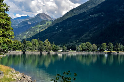 Scenic view of lake and mountains against sky