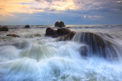 Scenic view of sea against sky during sunset