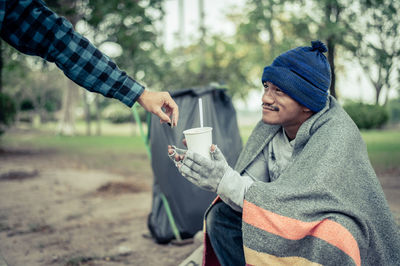 Young woman using mobile phone in winter