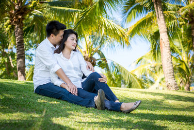 Young couple kissing in park