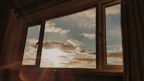 Cloudy sky seen through window