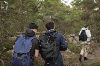 Rear view of men hiking