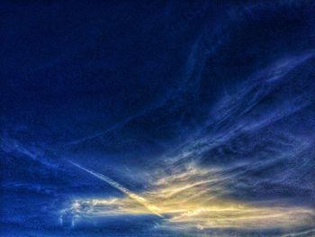 Low angle view of vapor trails in sky
