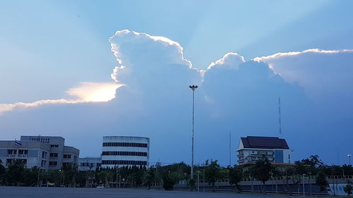 Low angle view of street and buildings against sky