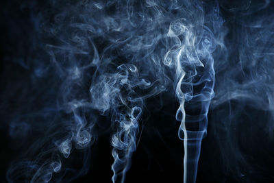 Close-up of smoke against black background