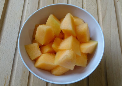 High angle view of chopped fruits in bowl on table